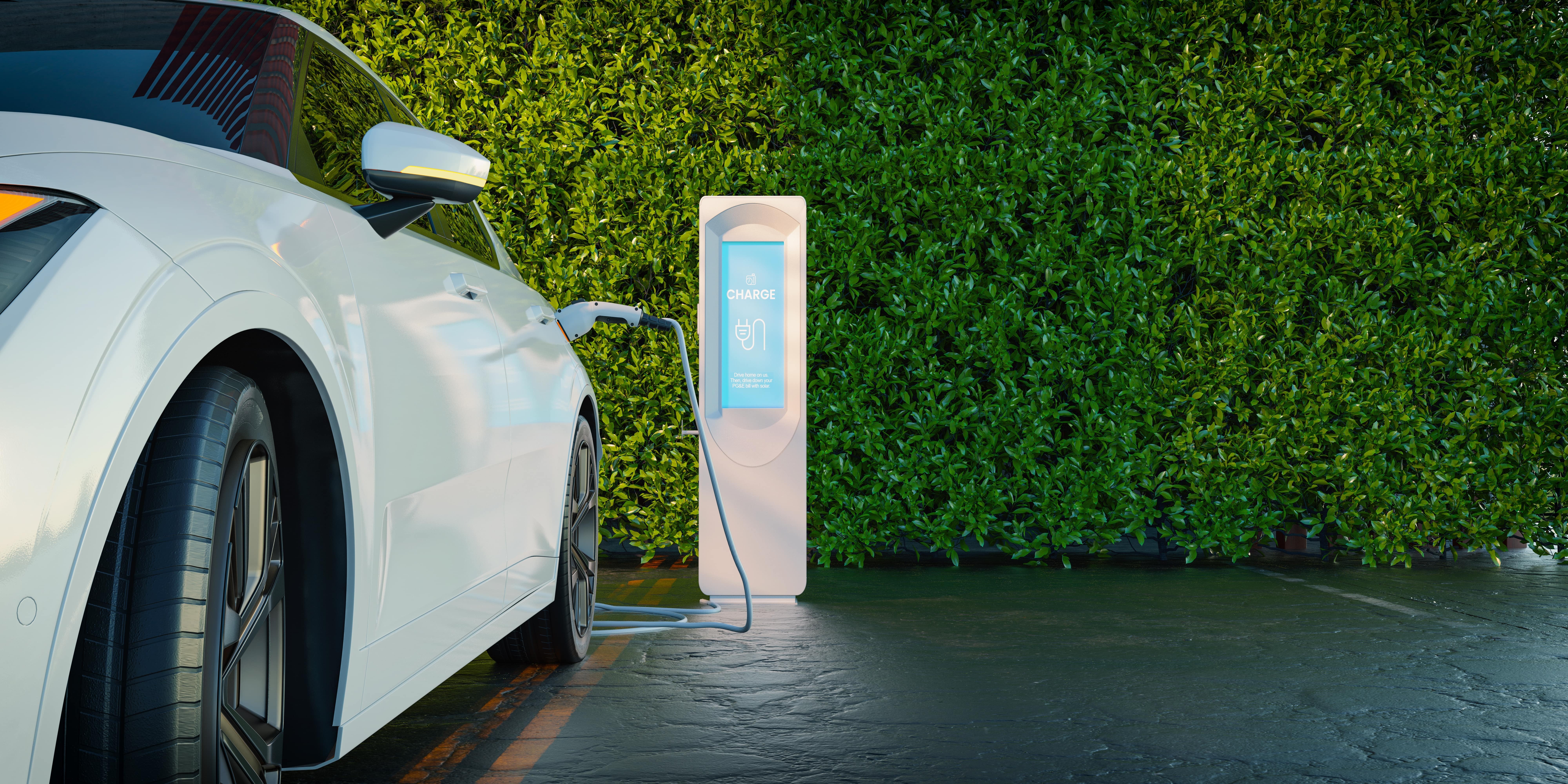 A white electric car is charging at a charging station.