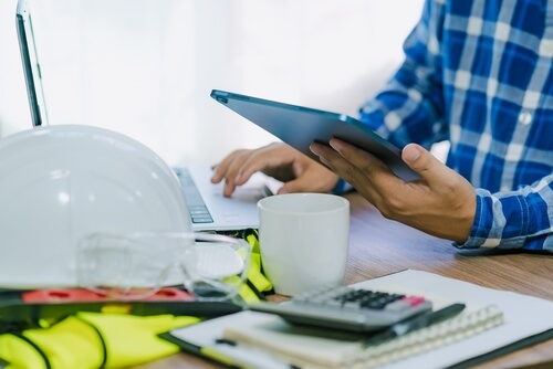 Construction Estimator working on a laptop 