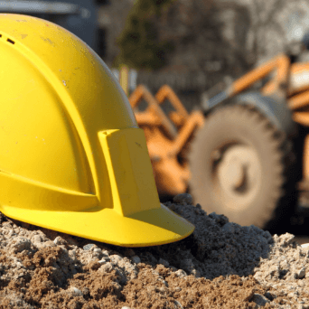 A hard hat in some dirt