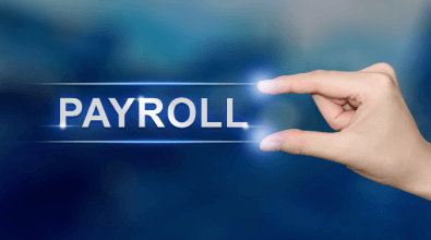 Hand pointing at a payroll sign