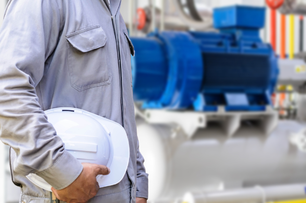 Person holding a white hard hat.
