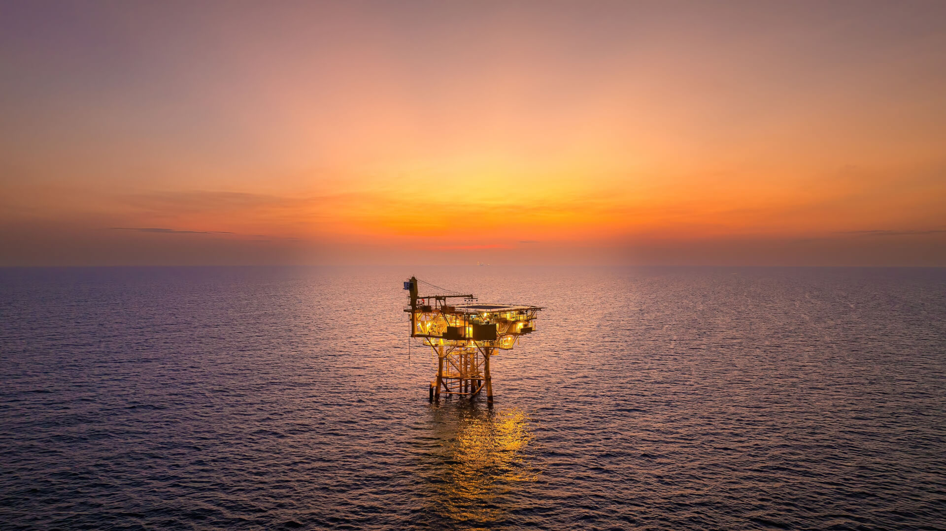 offshore oil rig in the sunset.