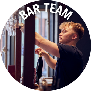 Bar team member puts away glasses. Link to Christmas Bar Jobs