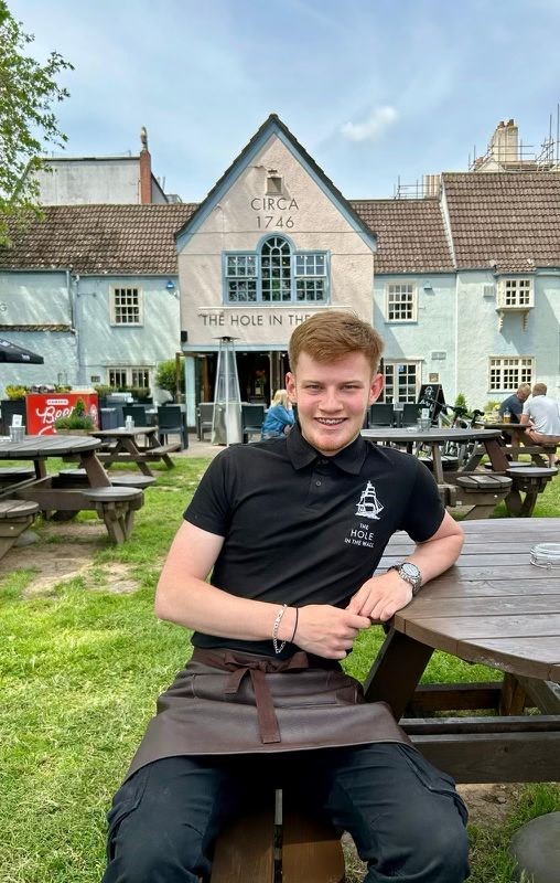 Student bar tender on bench