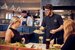 wait staff serving food to guests at M&B with a smile