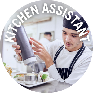 Kitchen Assistant adds chocolate sauce to dessert plate in a kitchen. Banner reads 'Kitchen Assistant' 