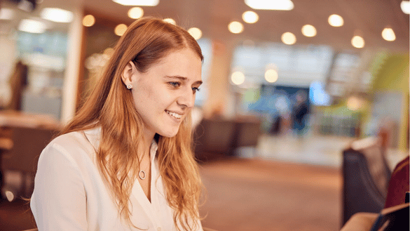 A graduate works on a project at Head Office