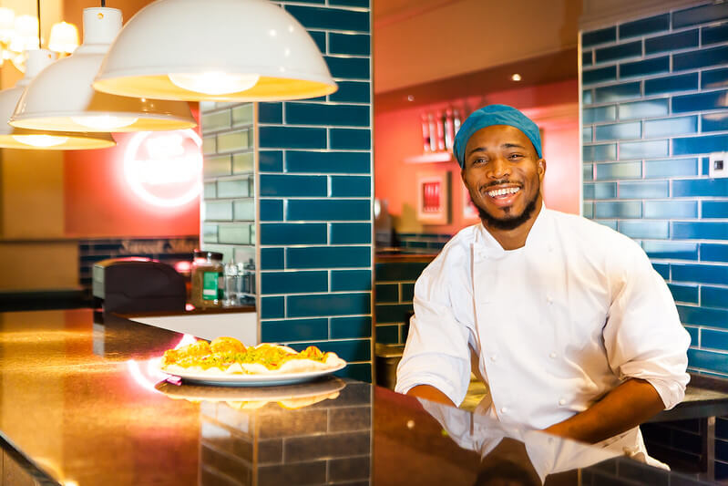 Man smiling in his dream Head Chef job