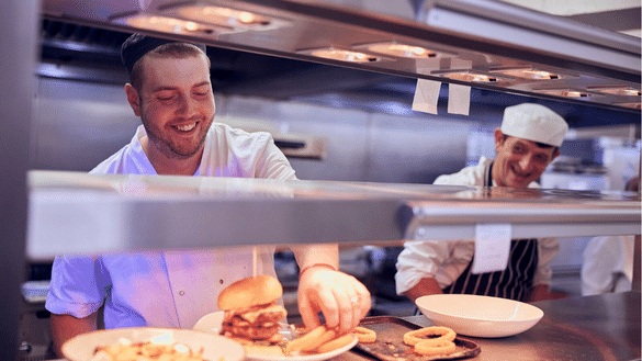 Chefs prepare food in an Ember Inns kitchen