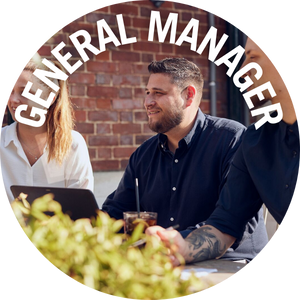 General Manager holds a team meeting in the outside area of a Castle pub