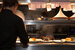 Professional pub kitchen with food being prepared and set on kitchen pass for waiting staff.