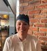 women in chef whites and hat smiling