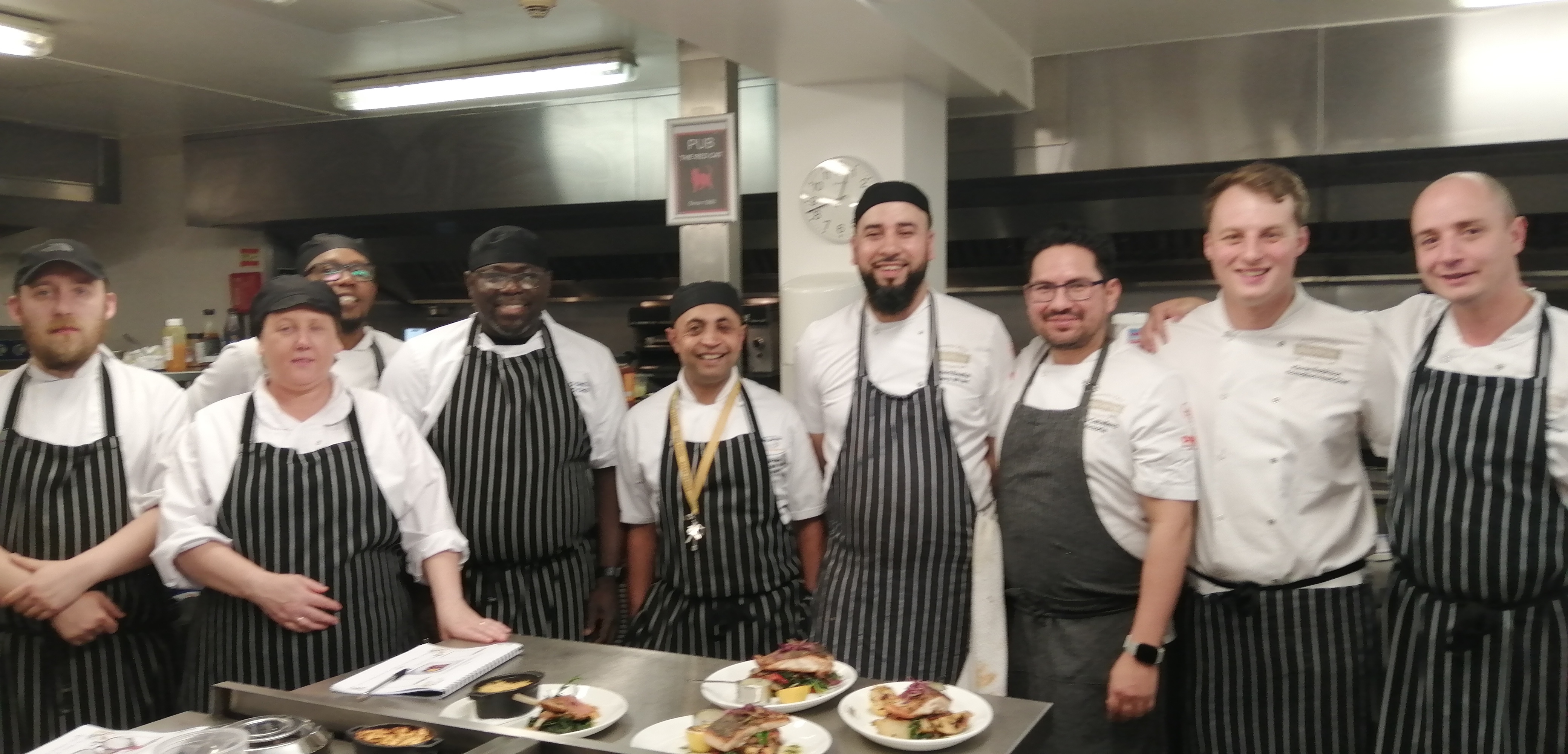 chef plating hot food in restaurant kitchen