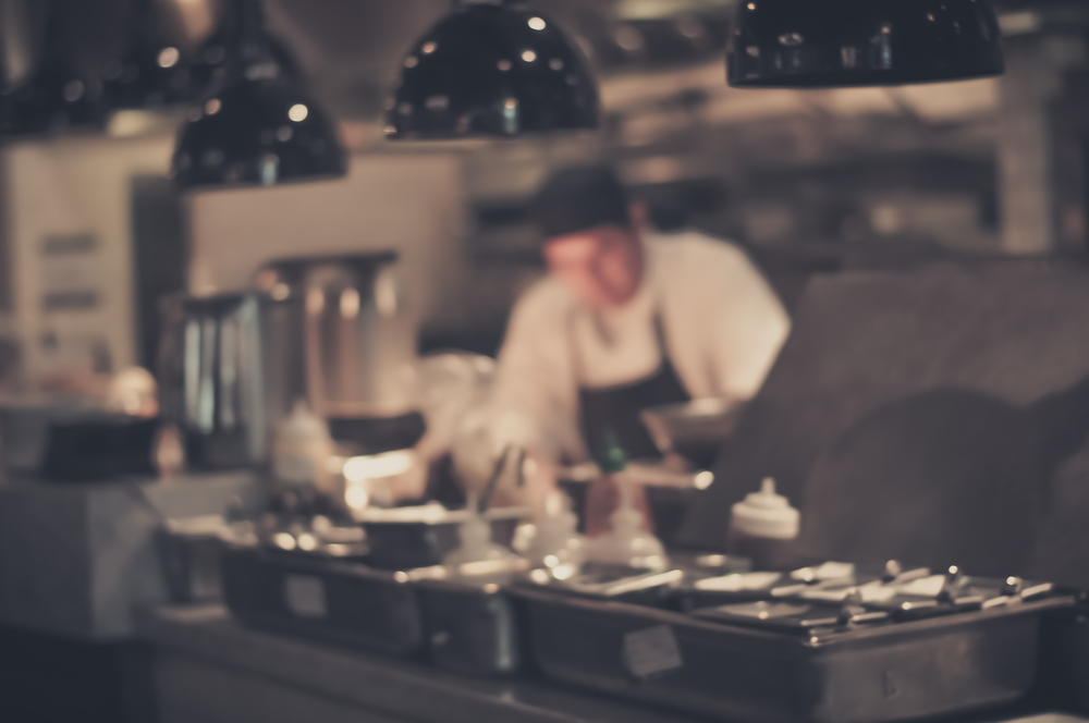 steel pans hanging in commercial kitchen