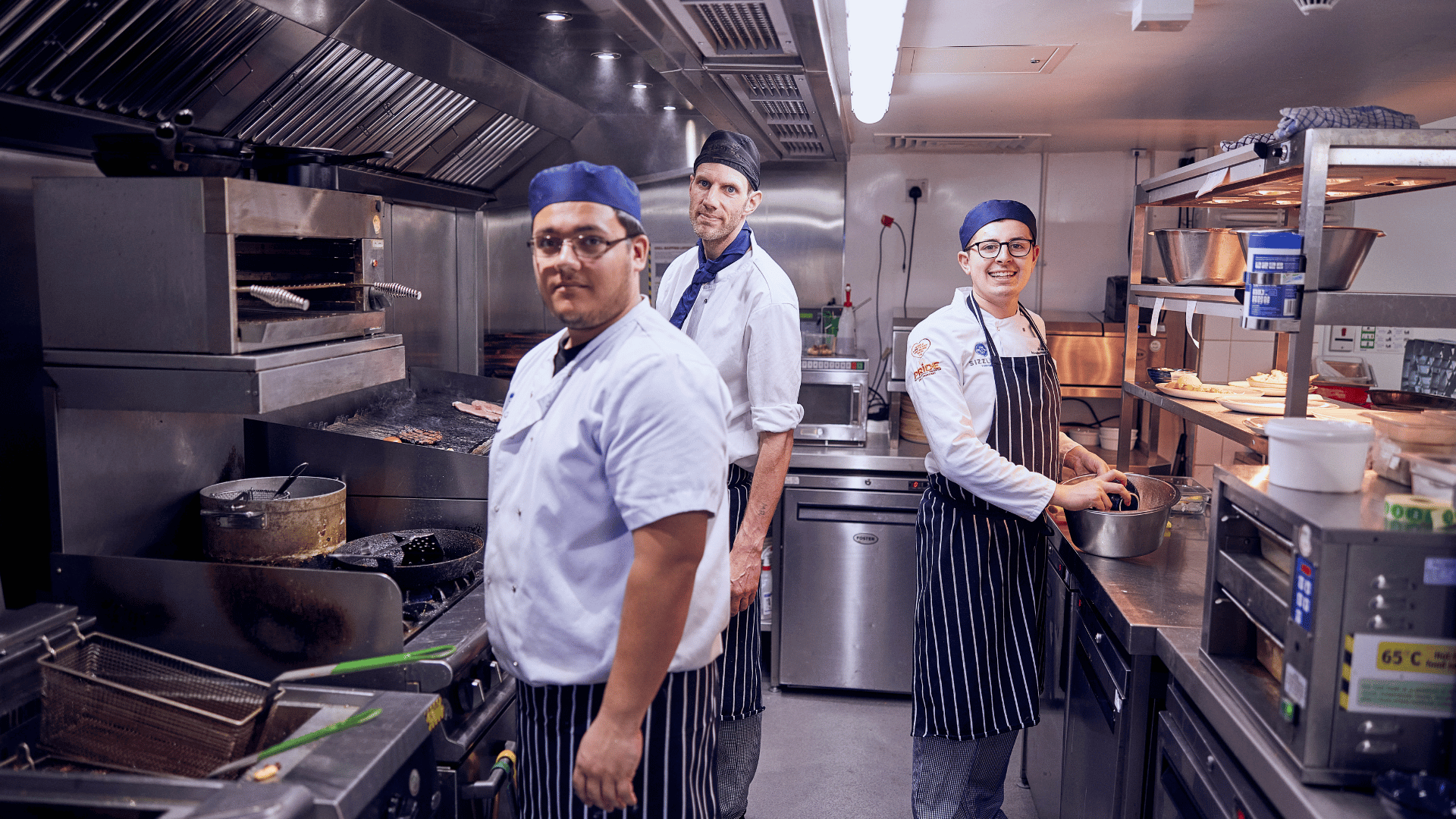 blurred table and chairs with wine glasses on top