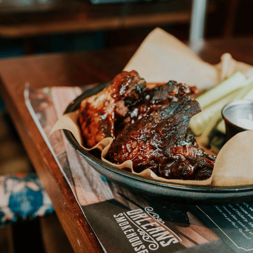 an image of a brightly lit Browns bar area with high bar stools and tables