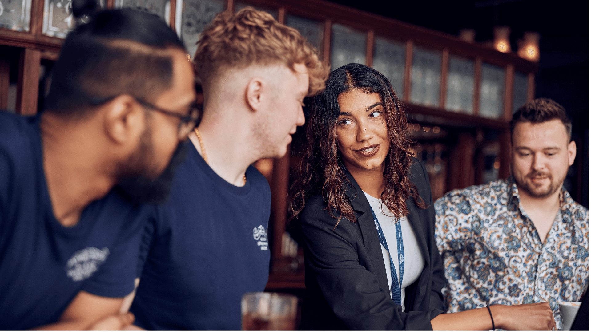 male chef smiling at assistant manager in kitchen