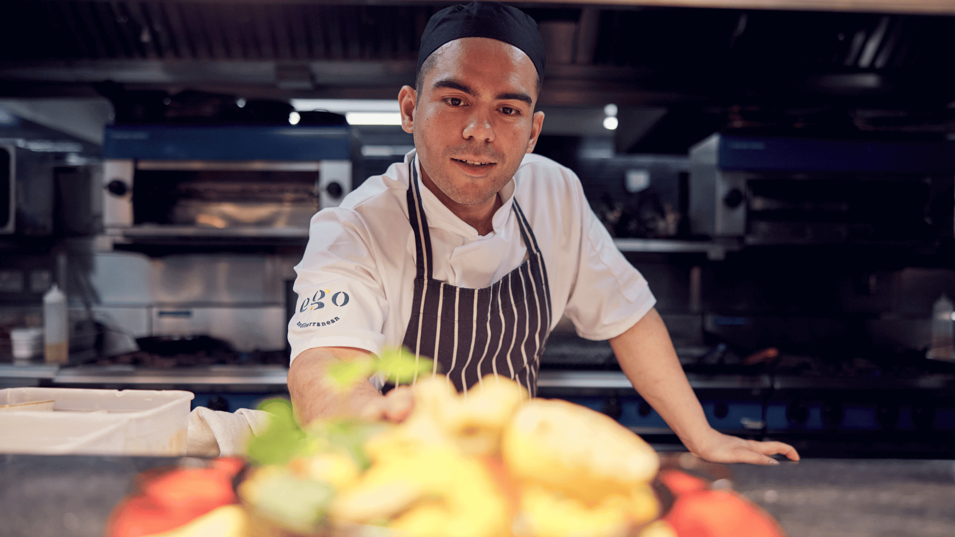 male chef cooking in a kitchen