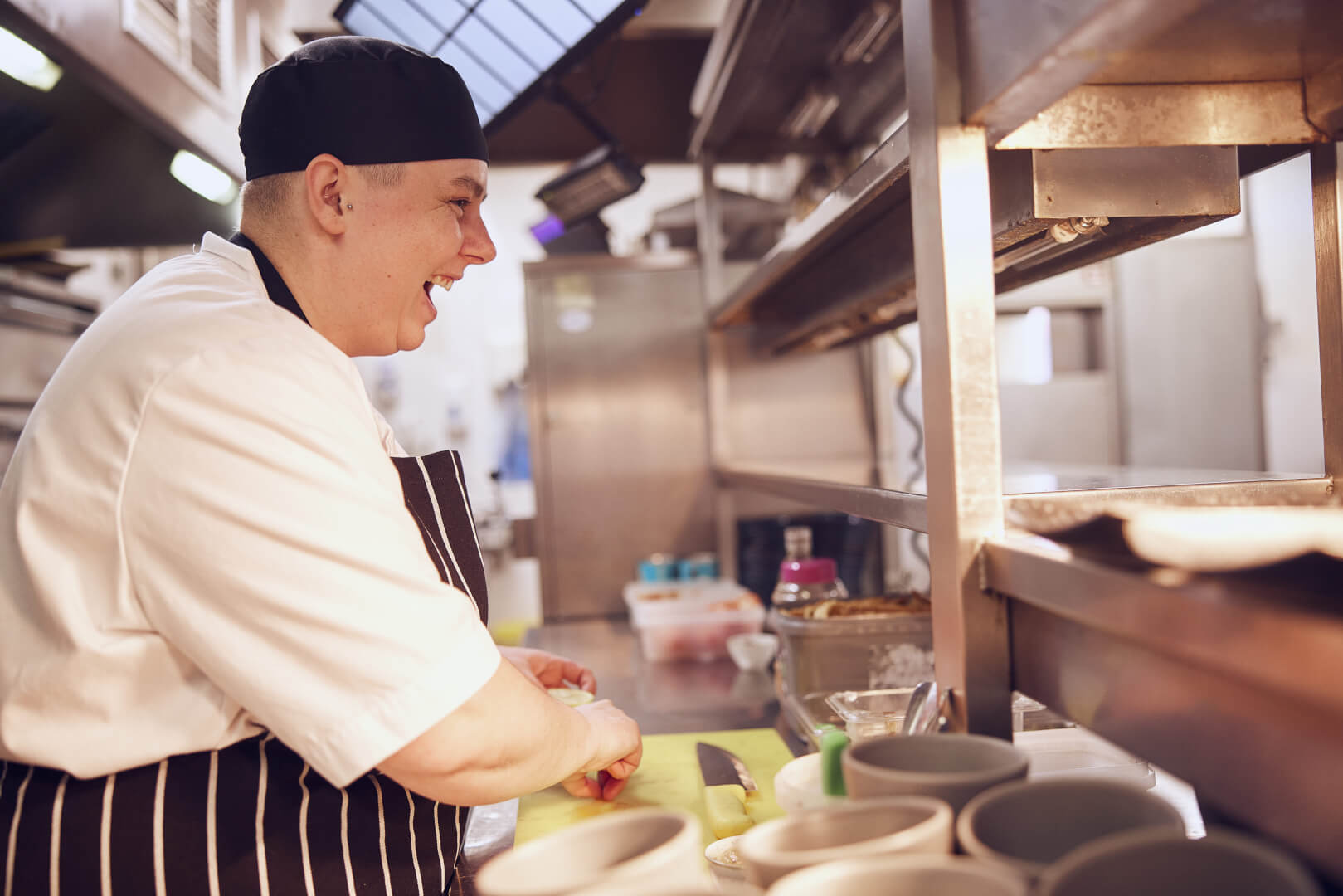 image of chef smiling in kitchen 
