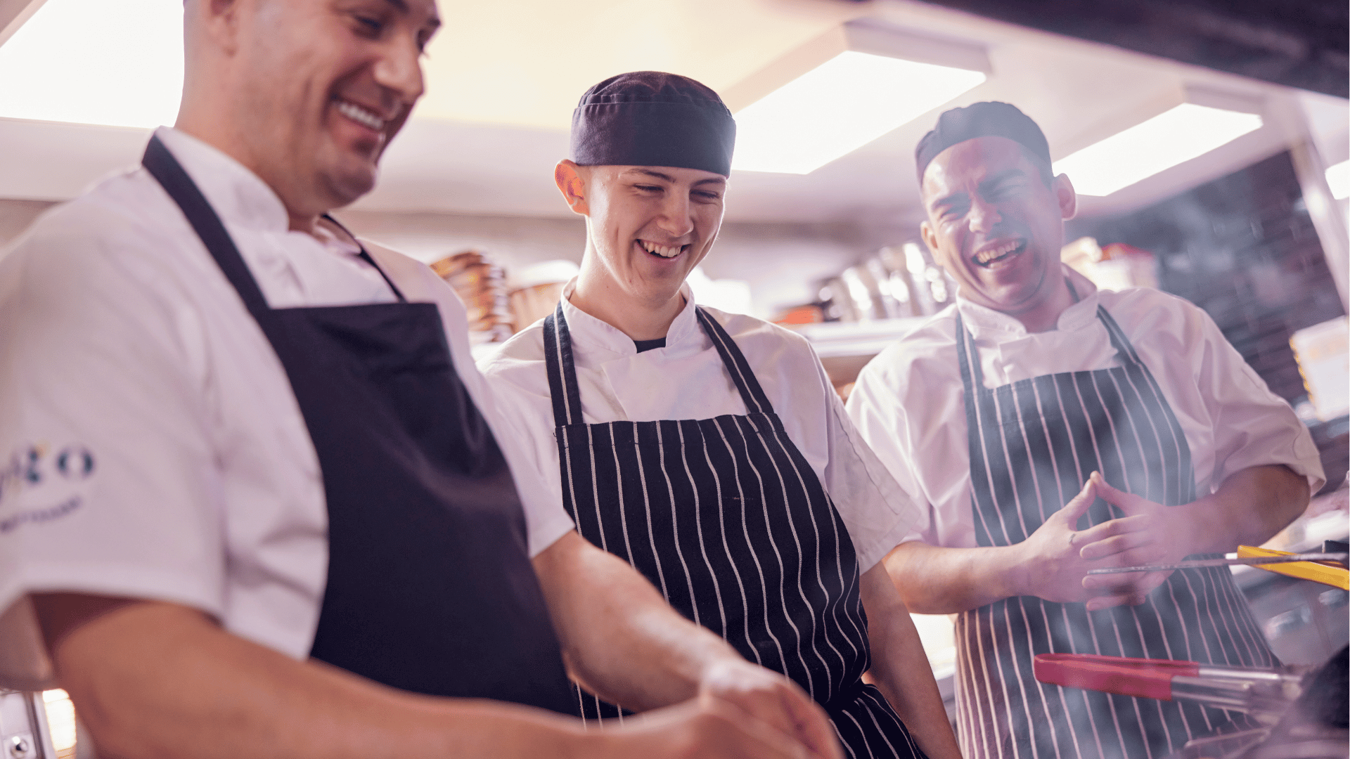 steel pans hanging up in commercial kitchen