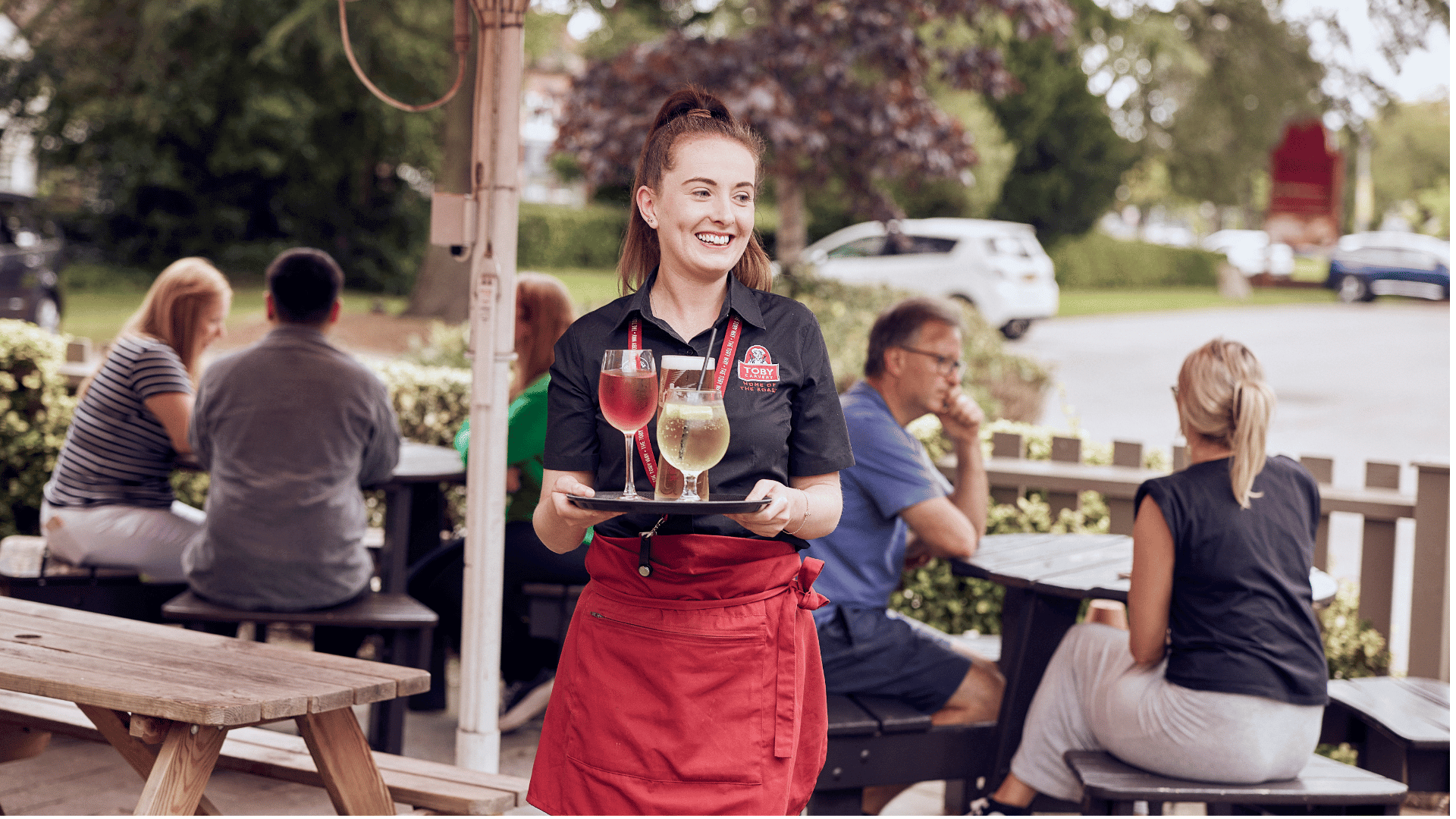 waiter and manager standing at pub bar