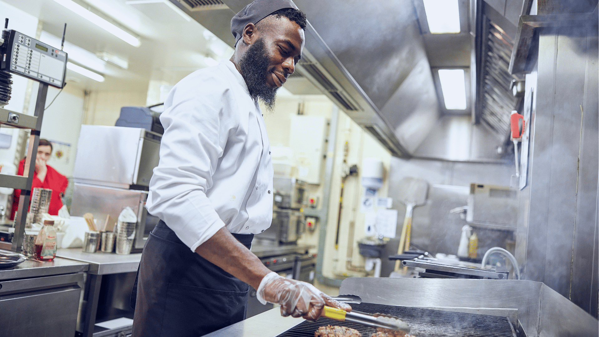 steel pans hanging in commercial kitchen