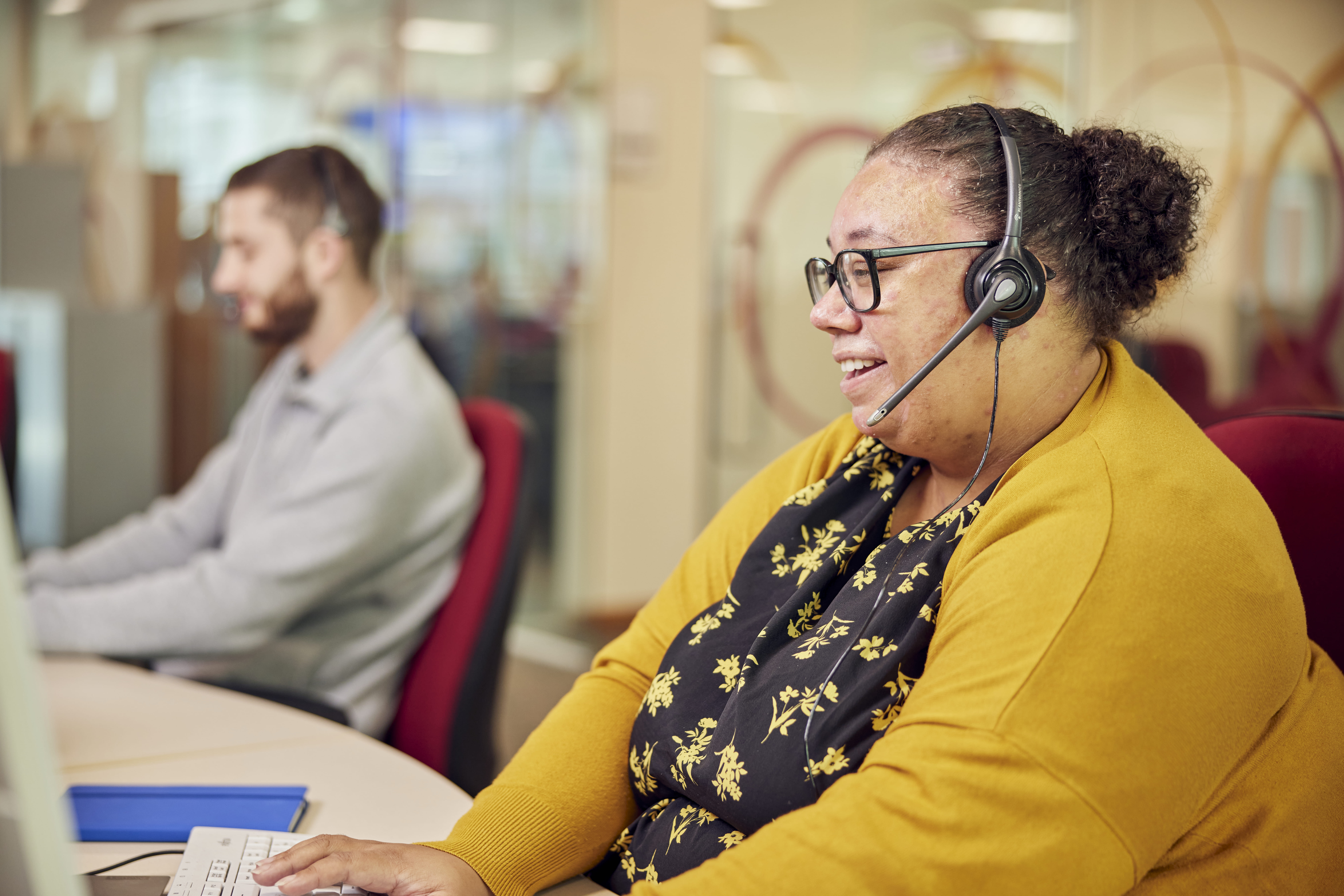 head office jobs at M&B - sales person on phone call sitting at their desk