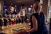 image of bar staff serving drinks with a smile
