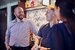 manager speaking with bar and wait staff and laughing