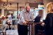 image of manager greeting guests at the entrance of a pub 