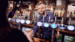 Female bartender standing behind bar