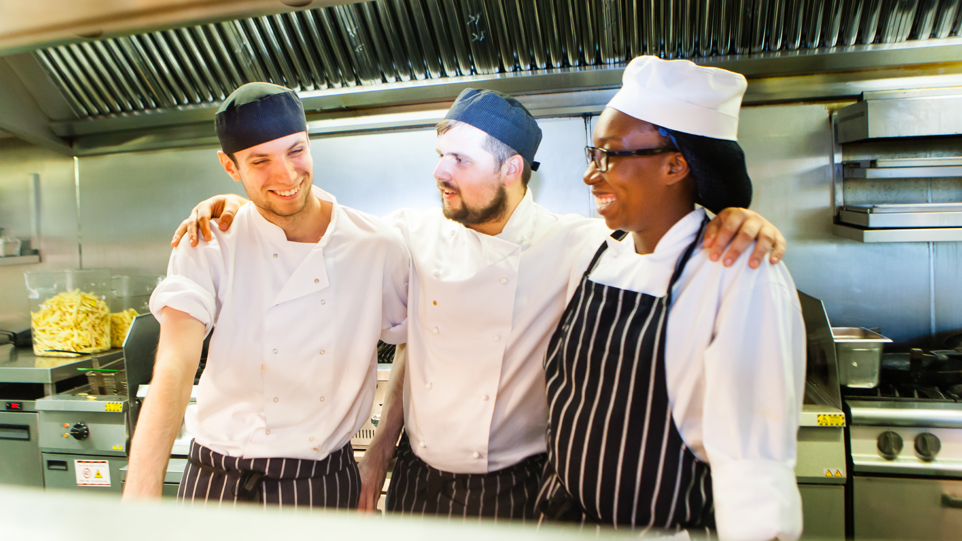 3 chefs in a kitchen