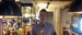 Male Assistant Manager behind bar