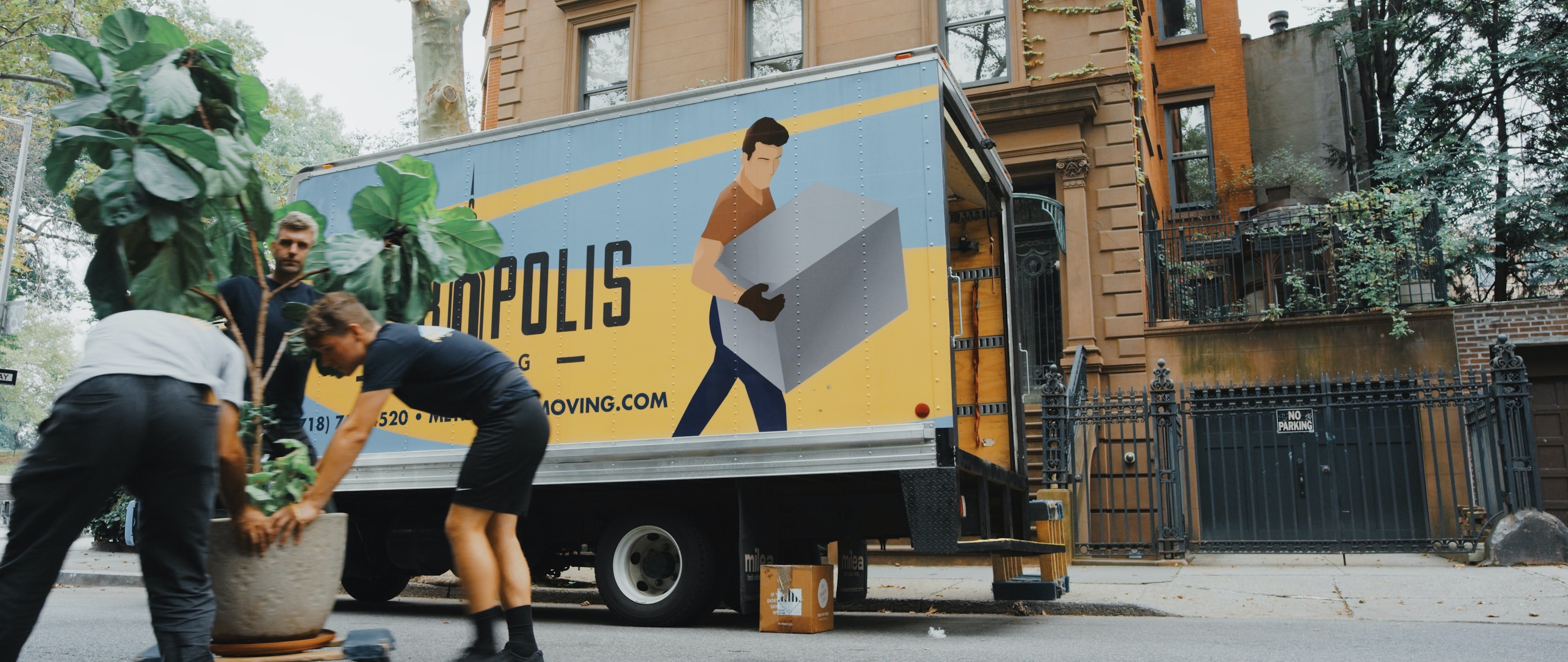 image of movers moving a plant 