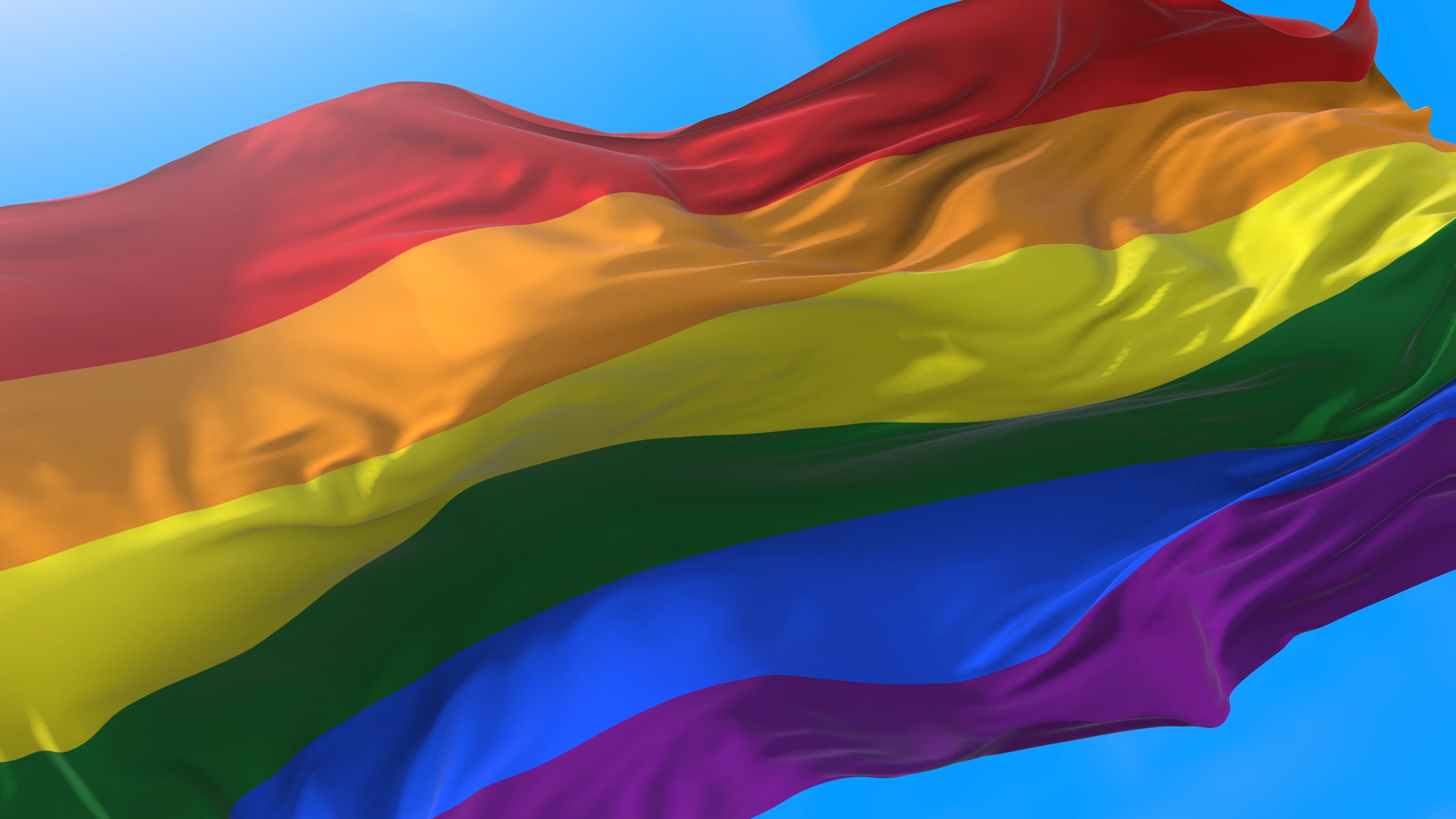Waving an LGBTQ+ flag