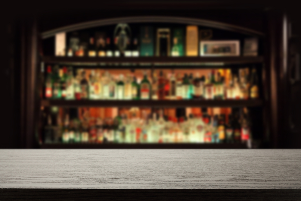 three shelves with bottles lined up