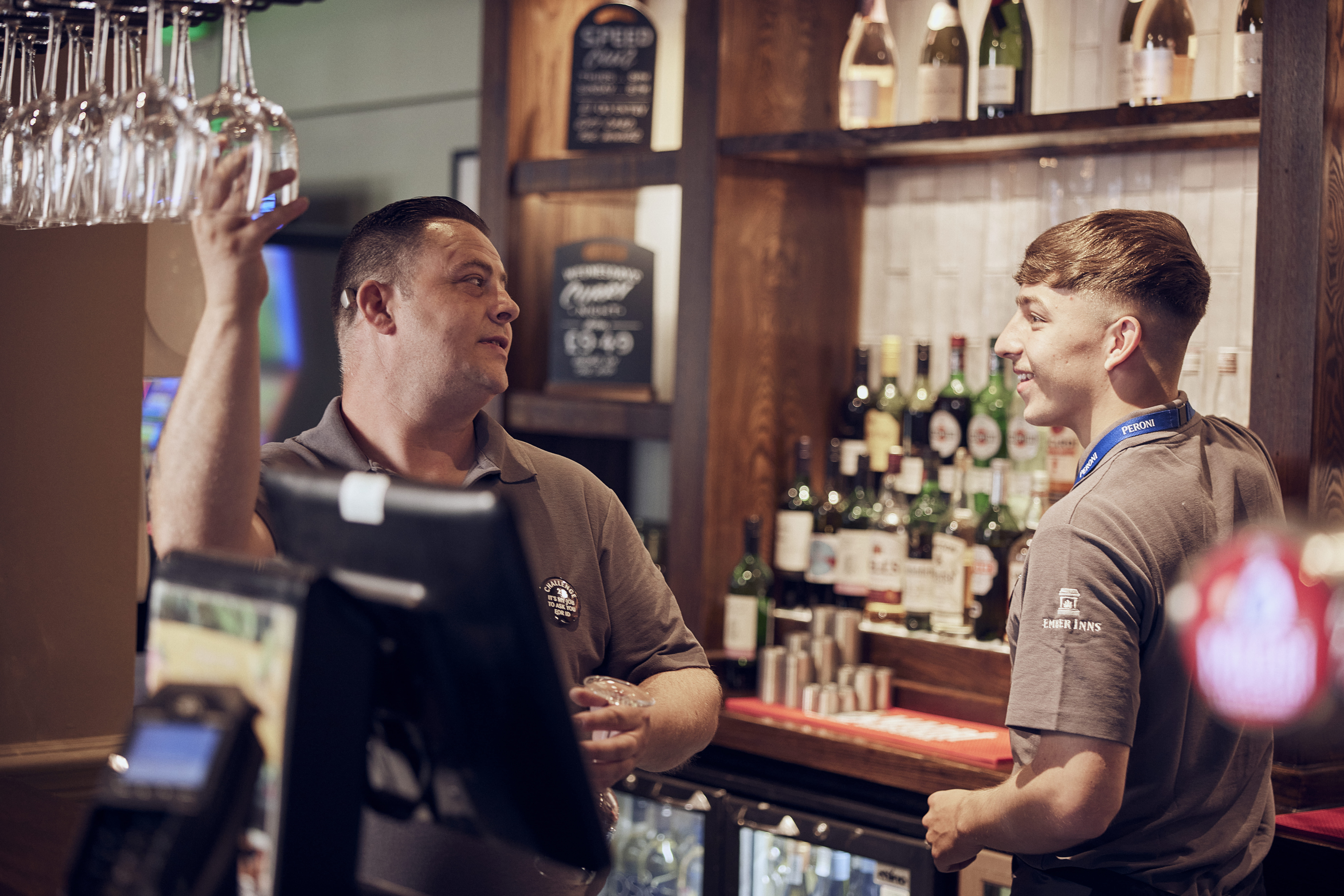 image of bartenders behind the bar 