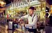 student pouring drinks behind bar at M&B 