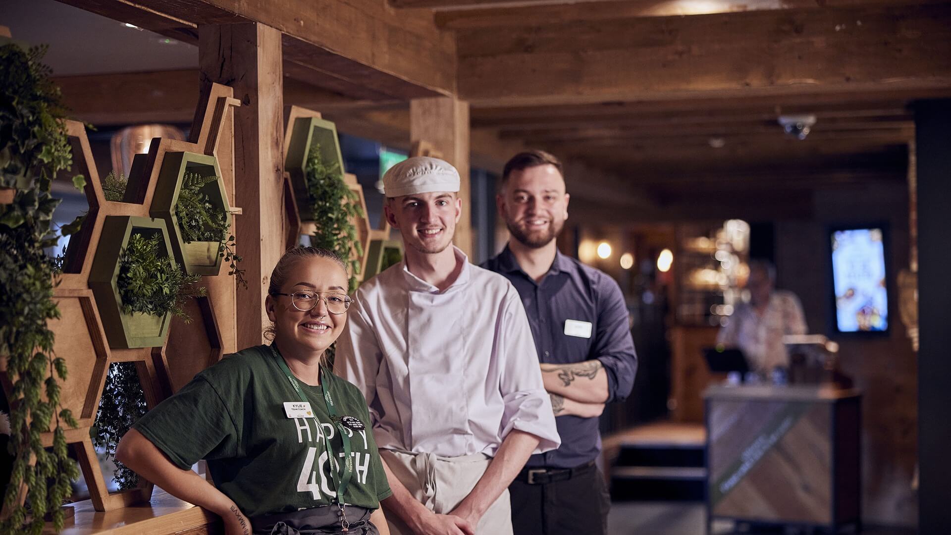 summer M&B staff smiling at camera