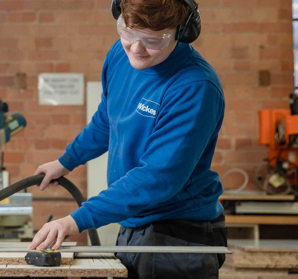 A man working on the machine looking happy