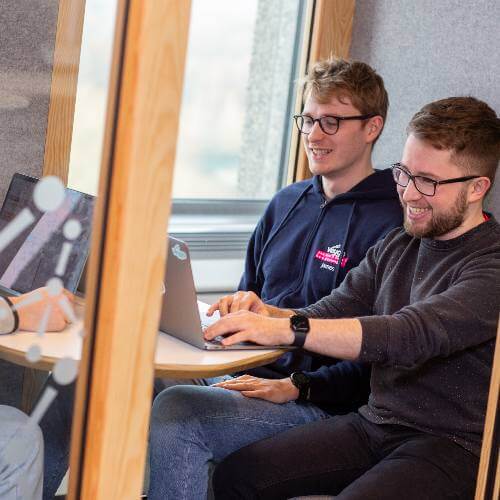 colleagues at a laptop