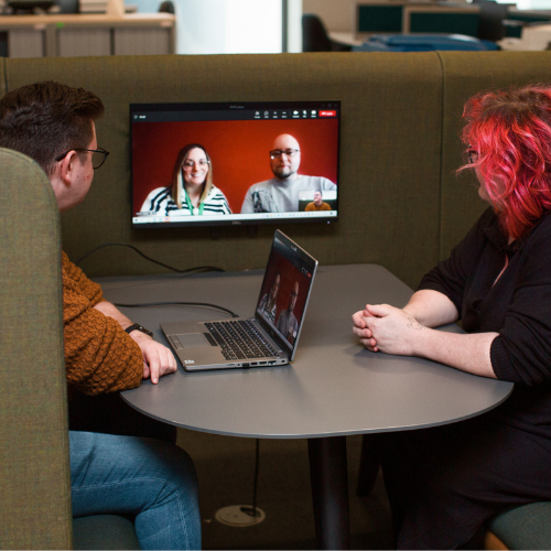 colleagues at a laptop