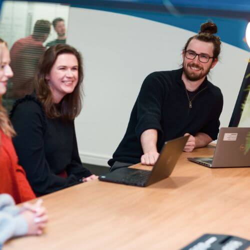 colleagues at a laptop