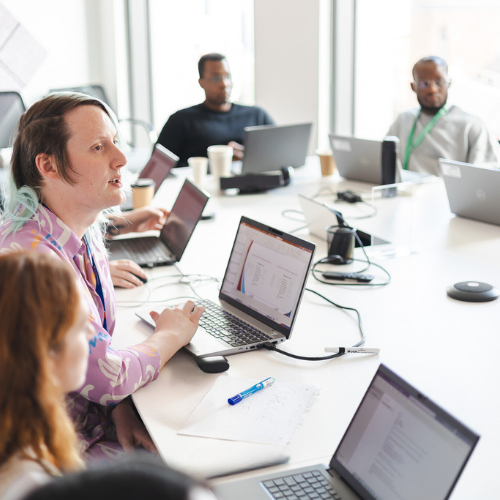 colleagues at a laptop