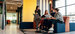 Multicultural businesspeople working in an office lobby. Group of happy governance, risk and compliance, smiling while sitting together in a co-working space