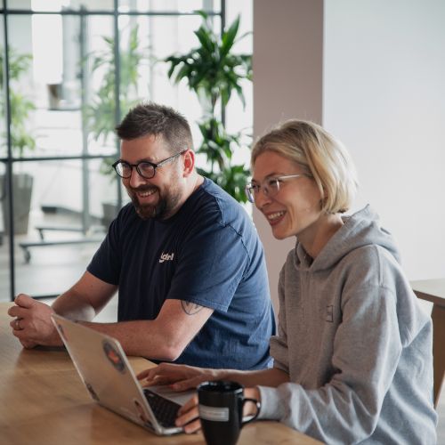 colleagues at a laptop