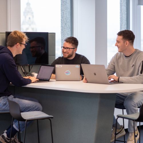 colleagues at a laptop