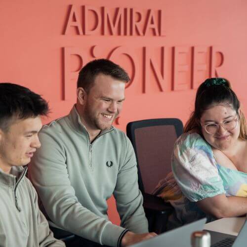 colleagues at a laptop