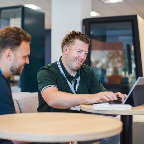 colleagues at a laptop