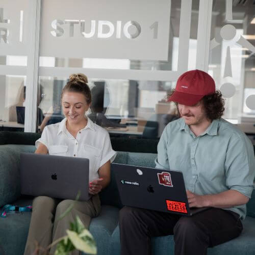 colleagues at a laptop